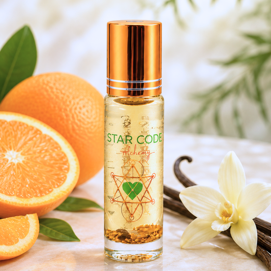Star Code Alchemy essential oil roll on bottle with oranges, vanilla bean, and flower on a light background